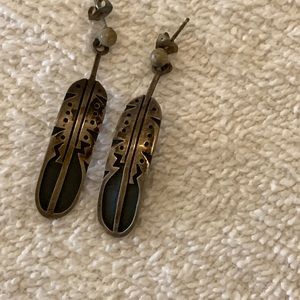 Silver feather earrings in good used condition
